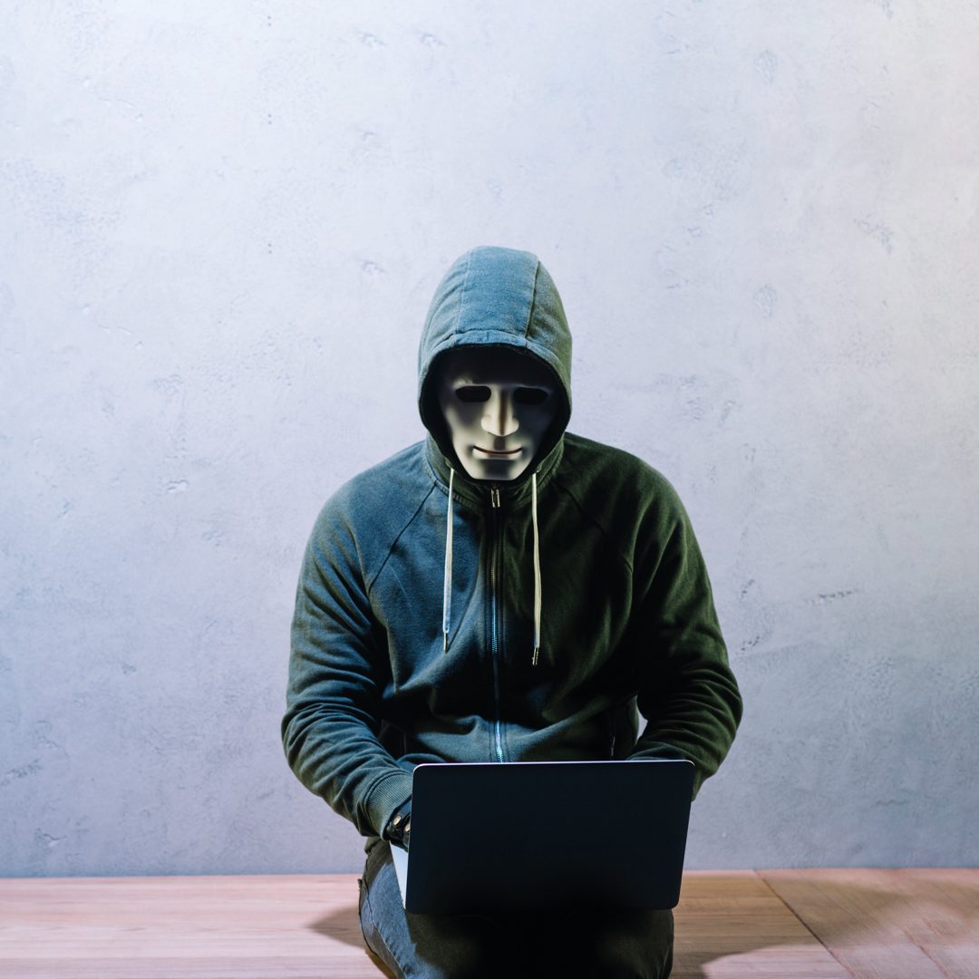 Hacker with Laptop - Travel Insurance in Dubai UAE