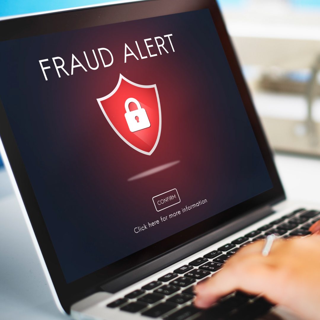 Fraud Alert Notification on Laptop - Travel Insurance in Dubai UAE